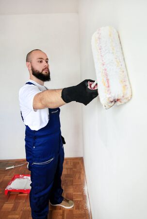 Construction worker doing finish renovation at apartment.の写真素材