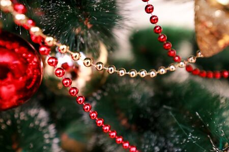 New Years colorful decoration ornaments on Christmas tree.の写真素材