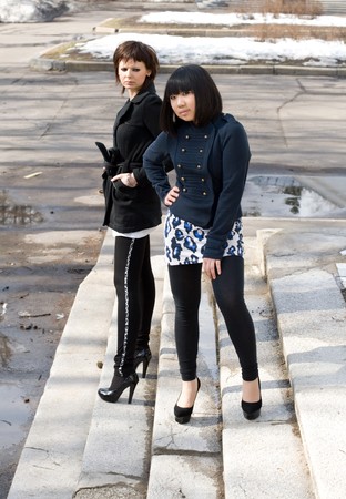 Two female friends walking outdoor の写真素材