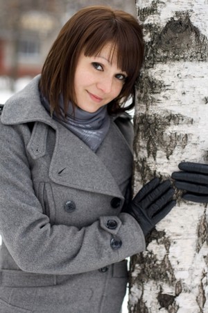Closeup portrait of a girl walking in winter parkの写真素材