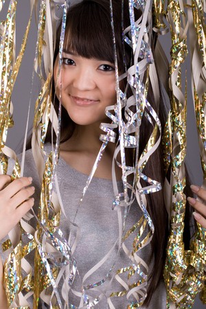 Girl standing among tinsel
