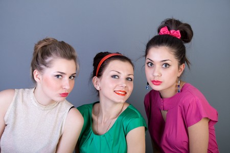 Three happy retro-styled girls の写真素材