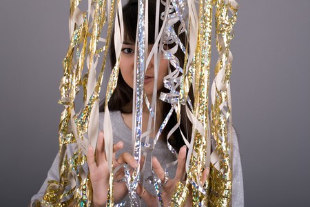 Girl standing among tinsel