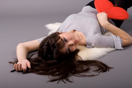 Beautiful woman holding red heartの写真素材