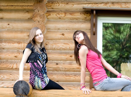 Two female friends on a veranda の写真素材