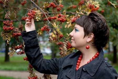 Pretty girl walking in autumn parkの写真素材