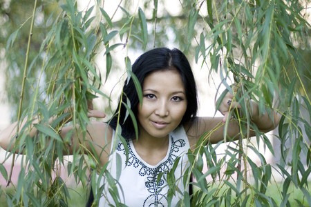 Girl walking in autumn parkの写真素材