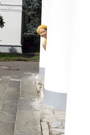 Closeup portrait of a girl with yellow flowerの写真素材