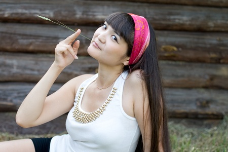 Beautiful girl sitting on hayの写真素材