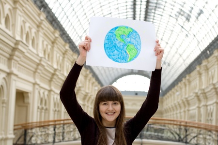 Happy girl holding a picture 