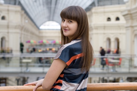 Pretty girl walking in a shopの写真素材