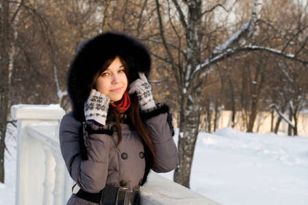 Portrait of a girl walking in park in winterの写真素材