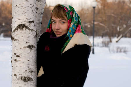 Portrait of a girl walking in park in winterの写真素材