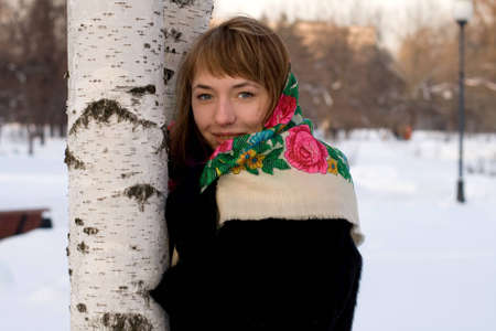 Portrait of a girl walking in park in winterの写真素材