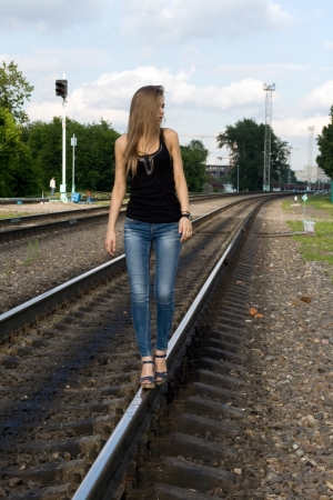 Girl traveling by railroadの写真素材