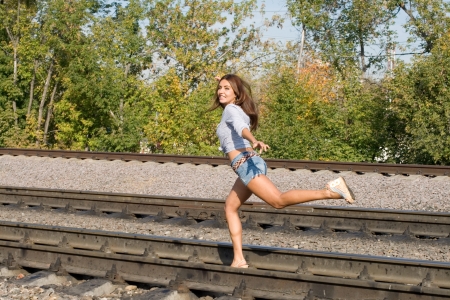 Sexy girl running on railsの写真素材