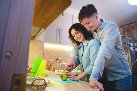 Young couple in love in the kitchenの写真素材