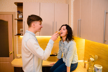 Young couple in love in the kitchenの写真素材
