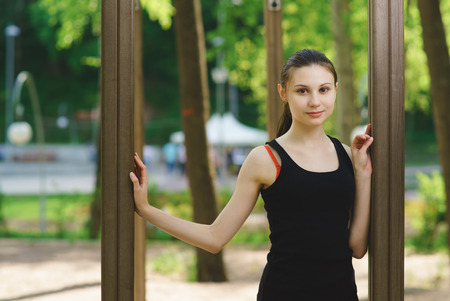 Portrait of a sports girl in the parkの写真素材