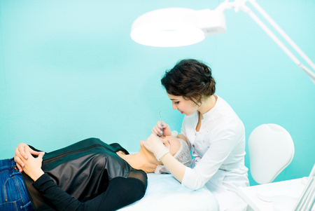 Doctor beautician cleansing faceの写真素材