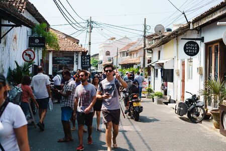 Galle, Sri Lanka -January 03, 2019: People and tuk tuks on a road inside the ancient Galle Fortのeditorial素材
