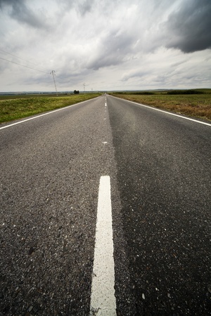 rural road between wheat cropsの写真素材