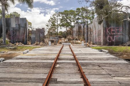 a small rusty private railway in Wrecking yard or junkyardのeditorial素材