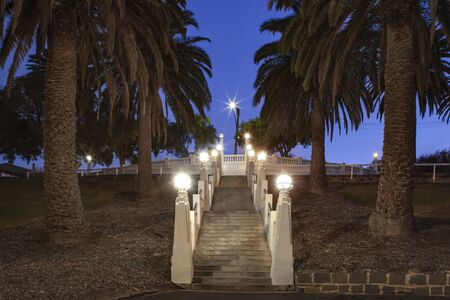 Eastern Beach fountain stairs looking up towards a dusk sky. This Spanish art deco style staircase,...