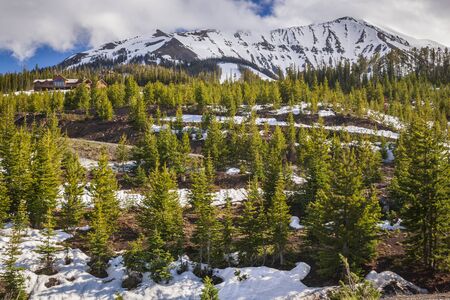 Moonlight Basin ski resort Montana set amongst pine trees and snow capped mountainsの写真素材