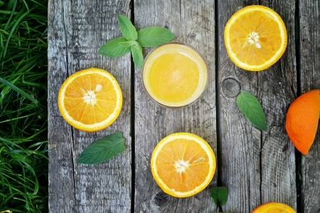 orange juice on the wooden backgrowndの写真素材