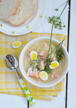 fish soup with  quail eggs in the white bowlの写真素材