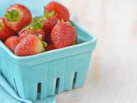 fresh strawberry in to blue bascketの写真素材