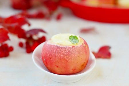 Baked apples with cottage cheese on autumn の写真素材