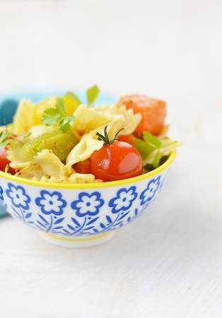 pasta with tomato and pumpkin in a bowlの写真素材