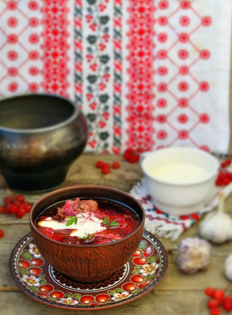 borsch, traditional Ukrainian beet and sour cream soup in a ceramic bowlの写真素材