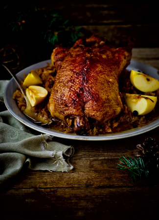 the duck baked with sauerkraut. traditional Russian and Ukrainian New Year's dish. selective focus. vintage style.の写真素材