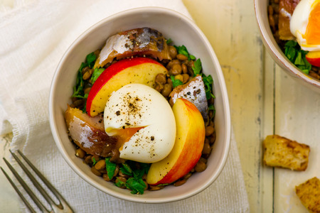lentil salad with egg, apples and croutons.の写真素材