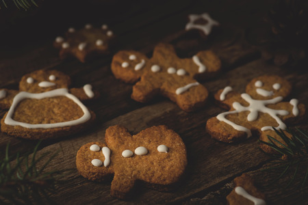 homemade  ginger cookies on a wooden background with Christmas scenery. vintage style.の写真素材