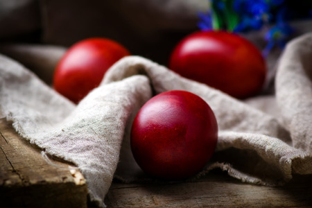 Easter colored eggs with spring flowers . rustic style. selective focusの写真素材
