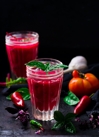 gaspacho with beet in glasses on a black metal background. style vintage. selective focus.の写真素材