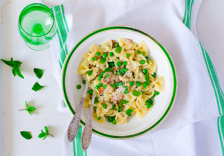 pasta with green peas and creamy sauce. style vintage. selective focus.の写真素材