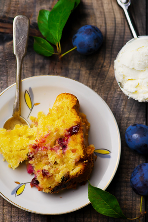 homemade plum  cake on wooden table. rustic style.selective focusの写真素材
