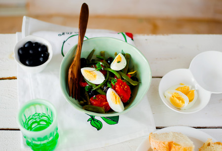 Salad from green beans with olives and egg. style vintage. selective focusの写真素材