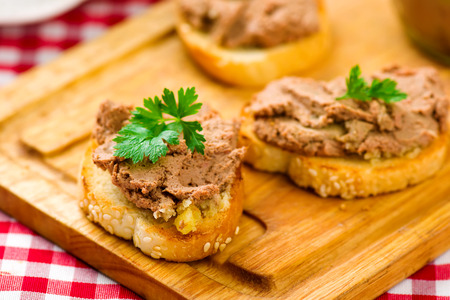 paste from a chicken liver on a wooden table.の写真素材