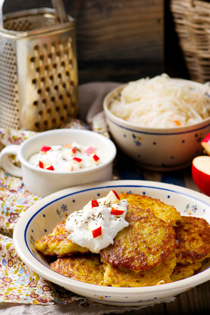 potato fritters with cottage cheese on a plate. style rustic.selective focusの写真素材