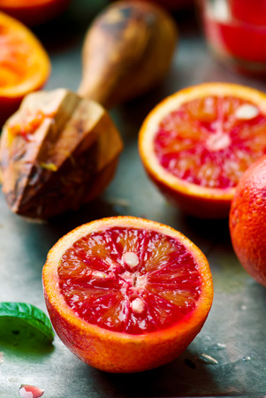 the fresh bloody oranges cut in half on a vintage metal tray. style vintage. selective focusの写真素材