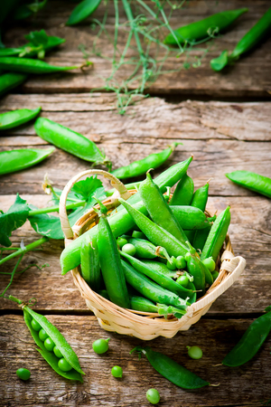 fresh, organic green peas. selective focusの写真素材