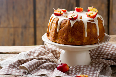 Fresh apples cake with cream cheese frosting.selective focus