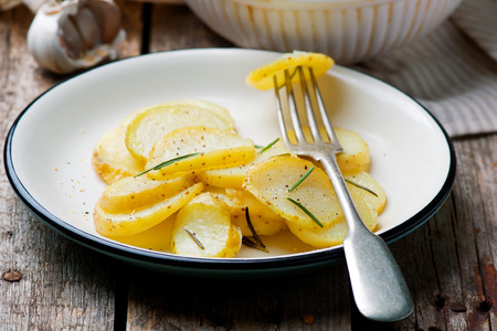 Baked  new potato with herbs.selective focusの写真素材