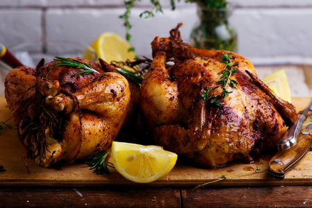 SUMAC ROAST CHICKEN WITH LEMON AND GARLIC..style rustic.selective focusの写真素材